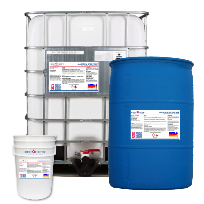 Three containers of varying sizes labeled "ALUMINUM-BRIGHTENER_product" with hazard identification signs: a small bucket, a large blue drum, and a white ibc tote of aluminum cleaner.